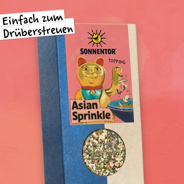 Asian Sprinkle spice in a pack with a window and an illustration of a waving cat.