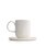 The photo shows a white porcelain coffee mug with saucer. It holds 330 ml and features the SONNENTOR letters..