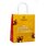 In the photo you can see a yellow paper tote bag with the inscription Ich schenke dir Freude.