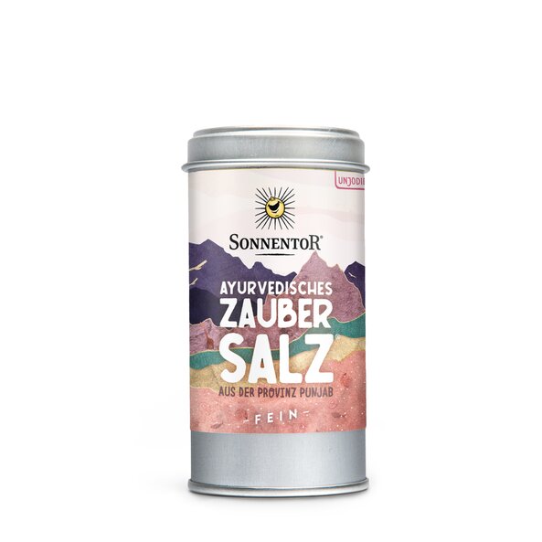 Foto einer Streudose Ayurvedisches Zaubersalz. Auf der Dose sind Berge in verschiedenen Farben zu sehen.